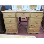 A Pine Pedestal Dressing Table, with single central drawer, flanking pedestals, plinth bases.