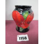A Moorcroft Pottery Vase, painted in the trial 'Red Rose' design, shape 146/3, impressed and painted