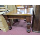 A Mahogany Square Shaped Coffee Table, with moulded edge on reeded block supports, 61 x 102cm.
