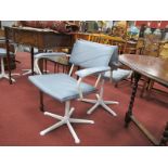A Set of Four White Metal Upholstered Chairs, on five star bases.