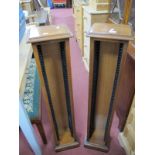 A Pair of Walnut CD Stands, with moulded edges, plinth bases, 21 x 102cm.