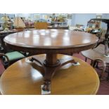 A XIX Century Mahogany Circular Table, on trefoil base, paw feet, 48cm high (reduced).