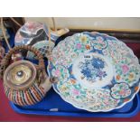 An Oriental Charger, painted to the centre with a vase of flowers, wavy rim, a studio pottery