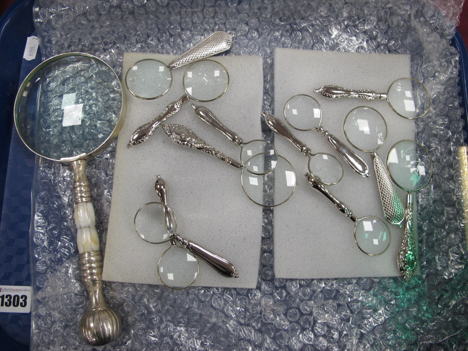 Thirteen Magnifying Glasses, of varying strengths:- One Tray