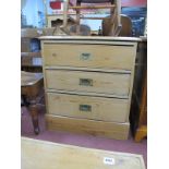 A XIX Century Pine Deep Chest of Three Graduated Drawers, having brass campaign handles, 72cm wide.