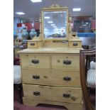 An Early XX Century Pine Dressing Table, having swing mirror, two jewel drawers over two short and