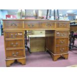 A Yew Wood Pedestal Desk, with scriver inset to top on twin flights, eight drawers in total, 122cm
