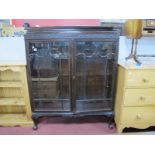 1920's Mahogany Display Cabinet, with blind fretwork carving to top, twin astragal doors, on squat