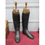 A Pair of Early XX Century Black Leather Riding Boots, with wooden sectional shoe trees, both