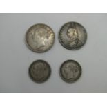Two Queen Victoria Halfcrowns 1887 (YH), 1887 (JH), one shilling 1887, one shilling 1884.
