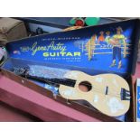 A Mid XX Century 'Gene Autry' Guitar, with automatic chord player. Appears little used, in