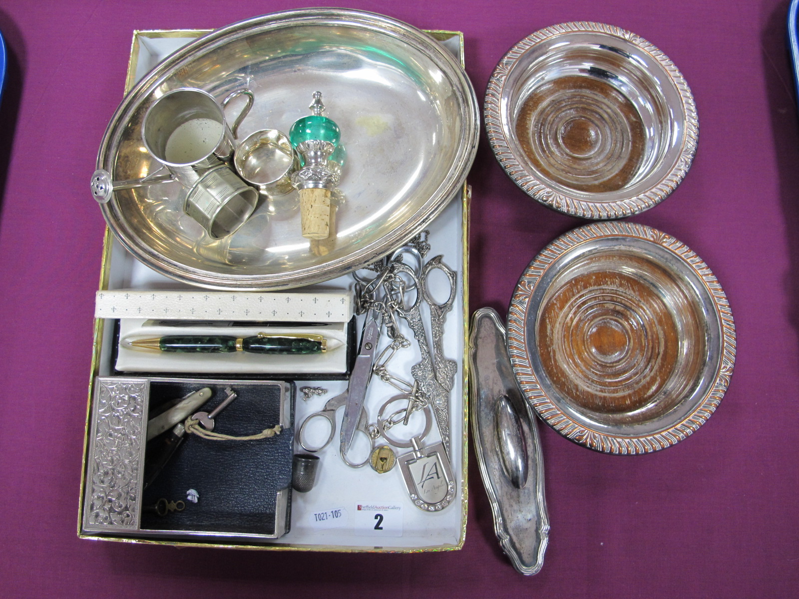 A Hallmarked Silver Mounted Buffer, two "Silver Plated" bottle coasters, an ornate bottle stopper,