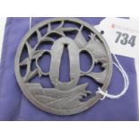 A Japanese Katana Sukashi Tsuba, unsigned, waves beat, fishing net and leaf design.