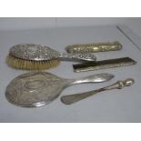 A Hallmarked Silver Backed Hair Brush, a hallmarked silver backed hand mirror, a shoe horn,