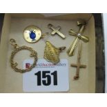 A 9ct Gold Cross Pendant, another similar, a 9ct gold "Isle of Wight" souvenir pendant, a Celtic