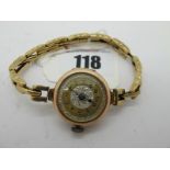 A 9ct Gold Cased Ladies Wristwatch, the decorative dial with black Arabic numerals, within plain