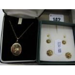 A Modern 9ct Gold Oval Locket, of foliate design, on fine chain, stamped "9ct", together with