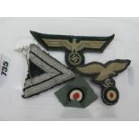 A Small Collection of WWII Period German Military Cloth Badges and a Pin Badge.