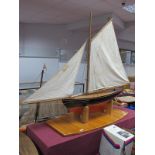 A Good Sized Wooden Hulled Pond Yacht 'Godiva', with full sails and rigging, hull 64cm long, overall