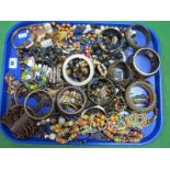 A Selection of Ethnic Costume Necklaces, beads, bangles, and bracelets, etc:- One Tray