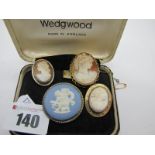 A Wedgwood Jasperware Brooch, circular in design (damages), in Wedgwood box, together with a shell