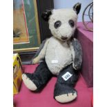 A Mid XX Century Black and White Teddy Bear, well loved.