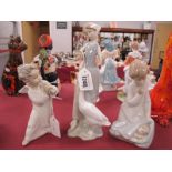 Lladro Figurines - Lady Feeding Goose, 23cm high and two Angels. (3)