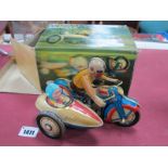 A Tinplate Motorcycle and Sidecar, boxed.