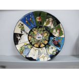 A Moorcroft Pottery Plate, painted in 'The Twelve Days of Christmas' design by Kerry Goodwin,