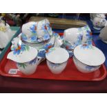 Collingwood Teaware, of twenty pieces, decorated with light blue and red flowers, the handles as