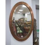 Oval Wall Mirror, in beaten copper frame, 84cm wide.