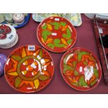 Poole Pottery - Two Plates in the Aegean Manner, with green and yellow decoration on red ground,