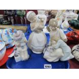 Lladro Figurines - Girls Admiring Cat, B-2N (finger chip) and Clown, 14.5cm high; Nao Girl Holding