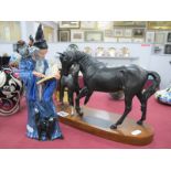 Beswick 'Black Beauty and Foal', on oval wooden base, Doulton figurine 'The Wizard' HN2877. (2)