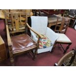 A Lloyd Loom Chair, bearing label; together with a 1920's oak carver chair and a pair of matching