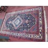 Middle Eastern Wool Tassles Rug, with allover geometric motifs on black and red ground, approx.