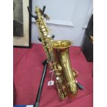 Brass Saxophone, with mother of pearl keys, makers names virtually obliterated but patented