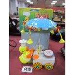 A Novelty Clockwork Toy Duck Pushing a Cart, boxed.