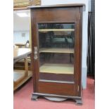 An Early XX Century Cabinet, with low back and glazed door to three internal shelves, on bracket