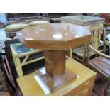 Art Deco Walnut Coffee Table, having octagonal top on block pedestal and square base, 57.5cm wide.