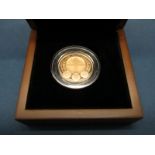 The Royal Mint 2010 UK London One Pound Gold Proof Coin, certified No.900, cased.