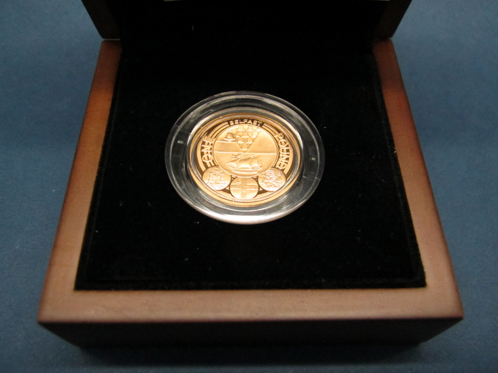 The Royal Mint 2010 UK Belfast One Pound Gold Proof Coin, certified No.0468, cased.