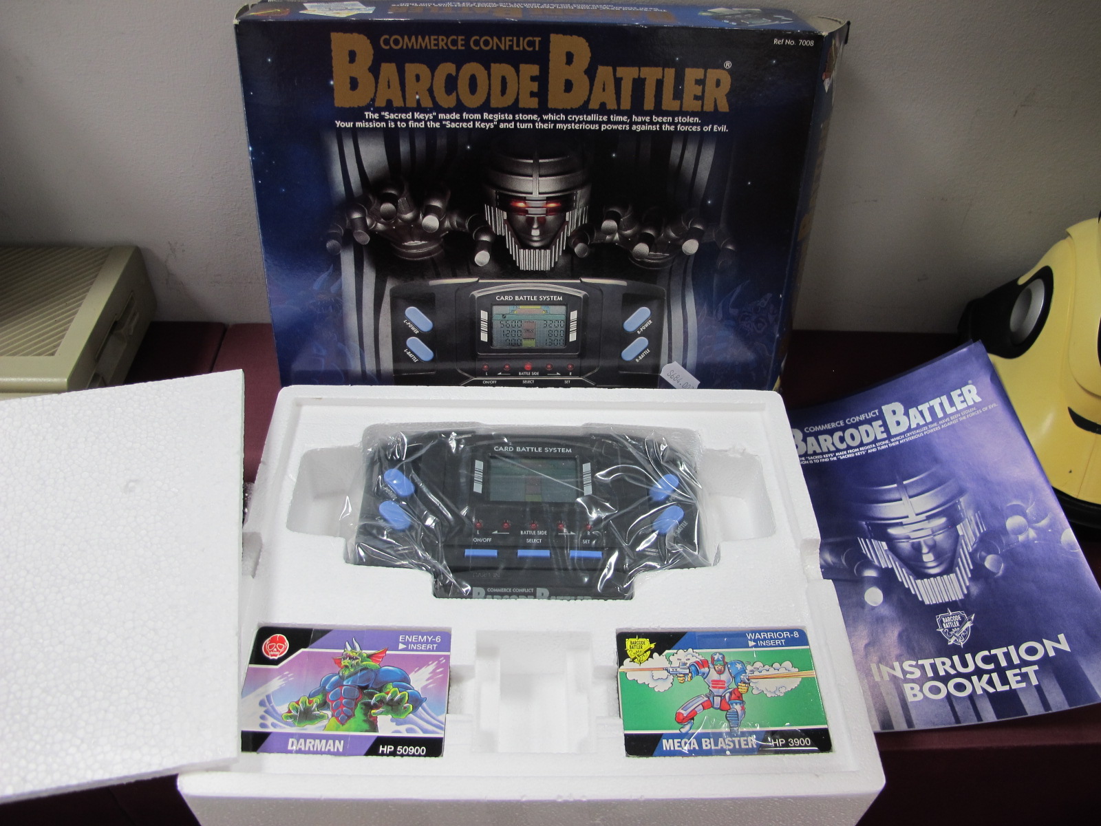 A Commerce Conflict Barcode Battler, by Tomy, appears unused, boxed.