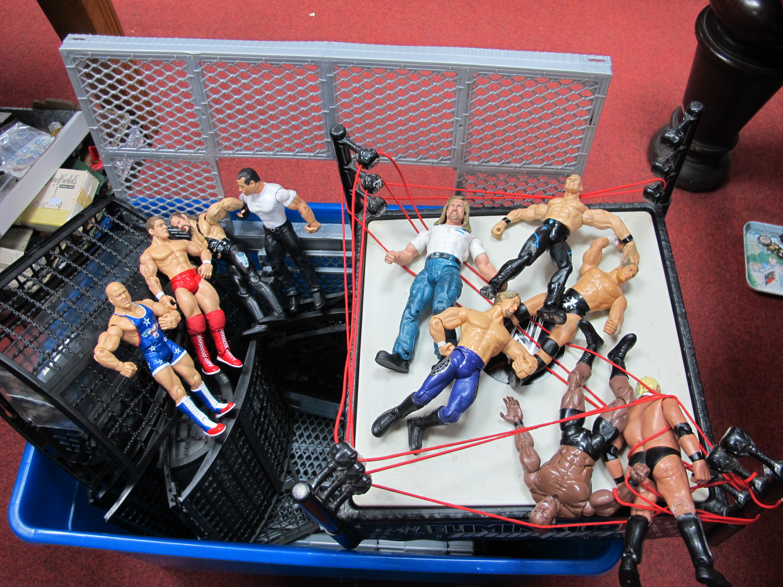 A WWF/WWE Elimination Chamber Cage and Wrestling Ring, by Mattel (unchecked) together with ten WWF/