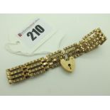 A 9ct Gold Gate Link Style Bracelet, to 9ct gold heart shape padlock clasp (8 grams)
