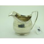 A Hallmarked Silver Cream Jug, (marks rubbed) with prick dot details and reeded edge and angular