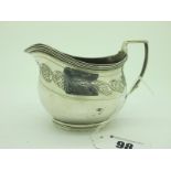 A Hallmarked Silver Cream Jug, (markers mark indistinct) London 1806, with foliate band, reeded