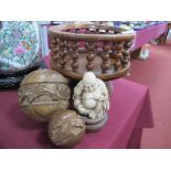 A Turned Wood Fruit Bowl, two graduated carved wood balls, Oriental figure.