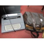 Smith Corona SL470 and Electric Automatic Typewriter, in tan, carry case. (2)