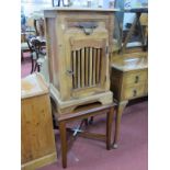 A Rustic Hardwood Pot Cupboard, 45cm wide, coffee table having 'X' stretcher. (2)